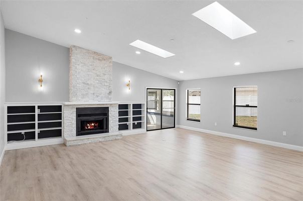 Empty room, Fireplace, Interior, Recessed Lighting, Wood Texture Flooring