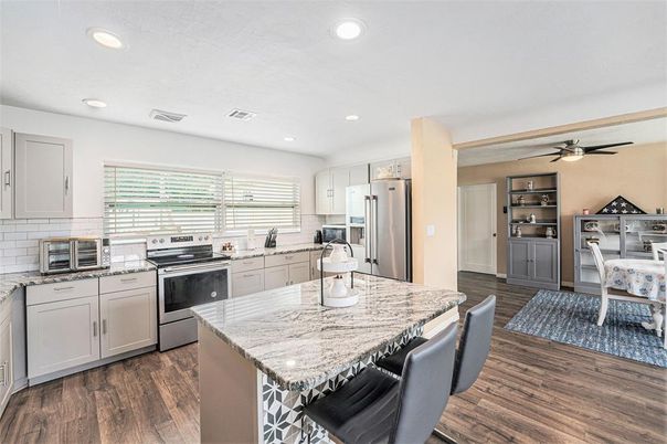 Dining room, Interior, Kitchen, Recessed Lighting, Stainless Steel Appliances, Wood Texture Flooring