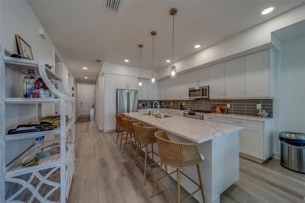 Interior, Kitchen, Pendant Lights, Recessed Lighting, Stainless Steel Appliances, Wood Texture Flooring