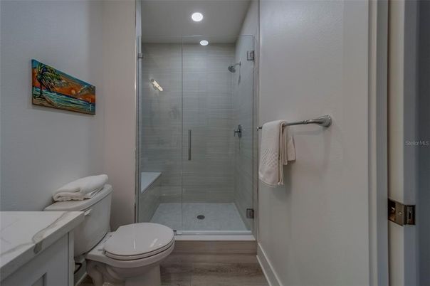 Bathroom, Glass Shower, Interior, Recessed Lighting, Wood Texture Flooring