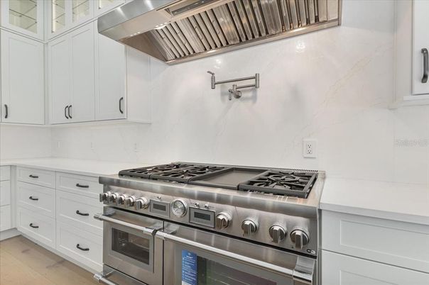 Interior, Kitchen, Marble Walls, Stainless Steel Appliances, Wood Texture Flooring