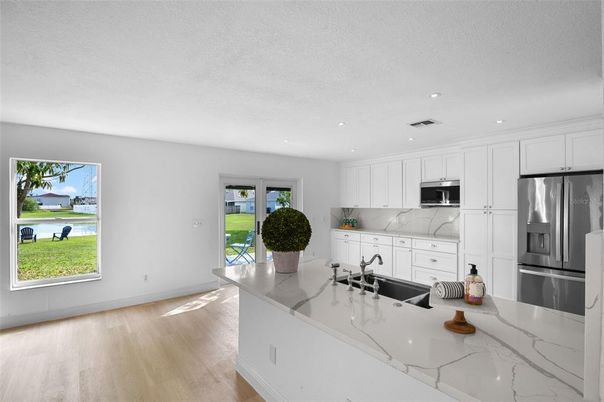 Interior, Kitchen, Recessed Lighting, Stainless Steel Appliances, Wood Texture Flooring