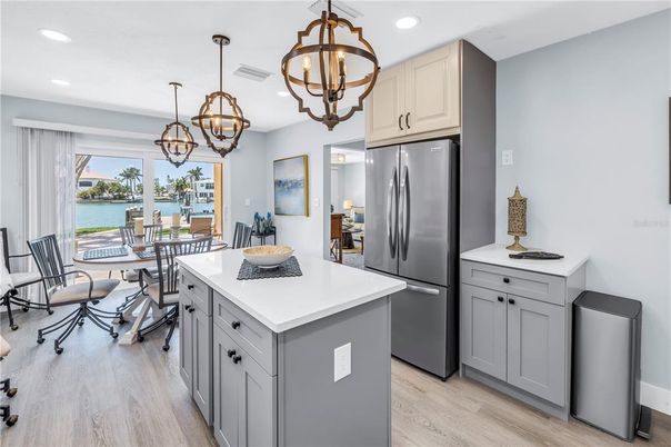 Chandelier, Dining room, Interior, Kitchen, Pendant Lights, Recessed Lighting, Stainless Steel Appliances, Water, Wood Texture Flooring