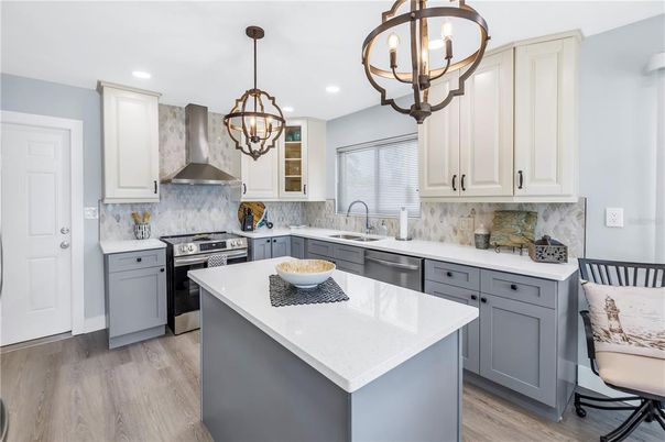 Chandelier, Interior, Kitchen, Pendant Lights, Recessed Lighting, Stainless Steel Appliances, Wood Texture Flooring