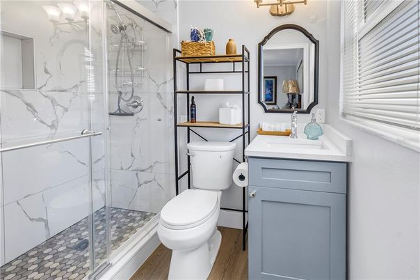 Bathroom, Glass Shower, Interior, Marble Walls, Wood Texture Flooring