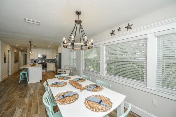 Chandelier, Dining room, Interior, Kitchen, Pendant Lights, Recessed Lighting, Stainless Steel Appliances, Wood Texture Flooring