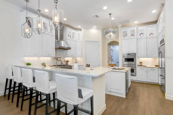 Chandelier, Interior, Kitchen, Pendant Lights, Recessed Lighting, Stainless Steel Appliances, Wood Texture Flooring