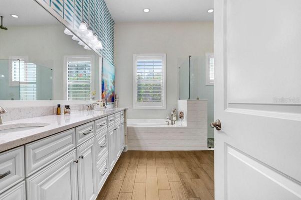 Bathroom, Dual Sink Vanities, Interior, Recessed Lighting, Wood Texture Flooring