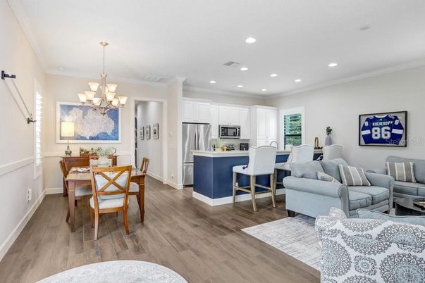 Chandelier, Dining room, Interior, Kitchen, Living room, Recessed Lighting, Stainless Steel Appliances, Wood Texture Flooring