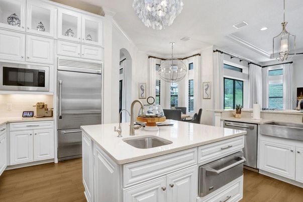 Chandelier, Dining room, Interior, Kitchen, Pendant Lights, Recessed Lighting, Stainless Steel Appliances, Wood Texture Flooring