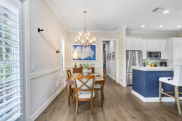 Chandelier, Dining room, Interior, Kitchen, Recessed Lighting, Stainless Steel Appliances, Wood Texture Flooring