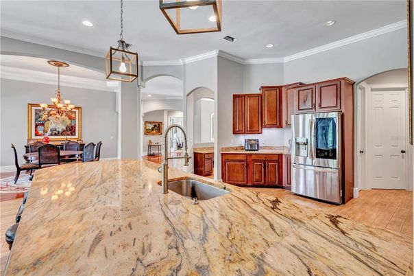 Chandelier, Dining room, Interior, Kitchen, Pendant Lights, Recessed Lighting, Stainless Steel Appliances, Wood Texture Flooring