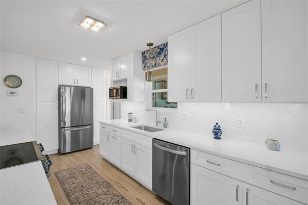Interior, Kitchen, Recessed Lighting, Stainless Steel Appliances, Wood Texture Flooring