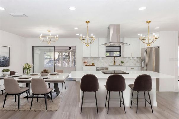Chandelier, Dining room, Interior, Kitchen, Pendant Lights, Recessed Lighting, Stainless Steel Appliances, Wood Texture Flooring
