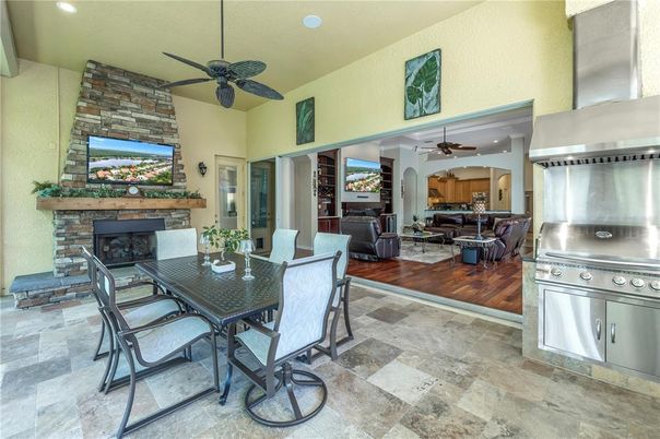Dining room, Fireplace, Interior, Living room, Recessed Lighting, Stone Walls, Wood Texture Flooring