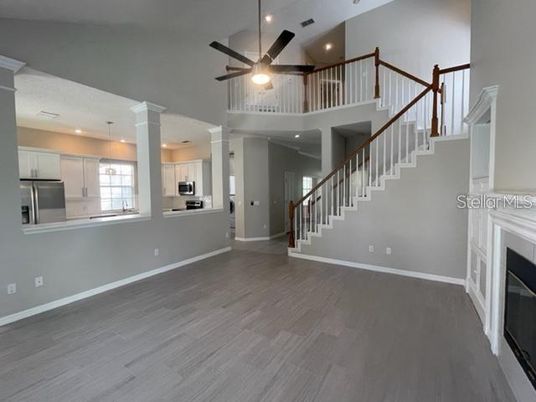 Fireplace, Interior, Kitchen, Pendant Lights, Recessed Lighting, Stainless Steel Appliances, Wood Texture Flooring