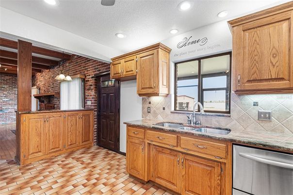 Interior, Kitchen, Pendant Lights, Recessed Lighting, Stainless Steel Appliances, Stone Walls