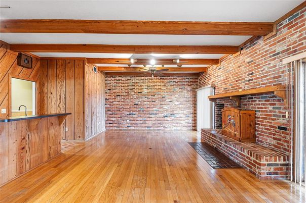 Empty room, Fireplace, Interior, Stone Walls, Wooden Beams, Wood Texture Flooring