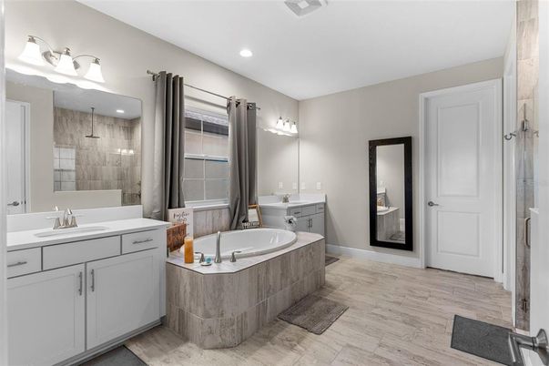 Bathroom, Dual Sink Vanities, Glass Shower, Interior, Recessed Lighting, Wood Texture Flooring
