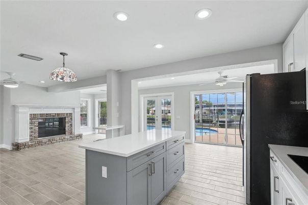 Fireplace, Interior, Kitchen, Pendant Lights, Recessed Lighting, Wood Texture Flooring