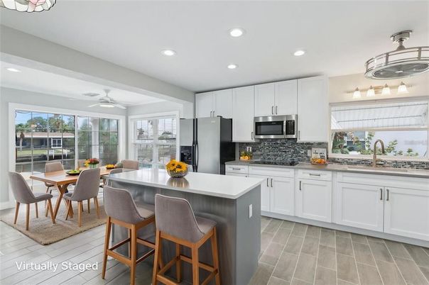 Dining room, Interior, Kitchen, Recessed Lighting, Stainless Steel Appliances, Wood Texture Flooring