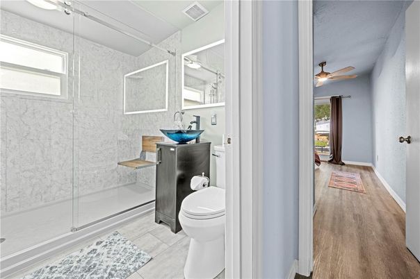 Bathroom, Glass Shower, Interior, Marble Walls, Wood Texture Flooring