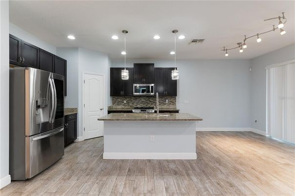 Interior, Kitchen, Pendant Lights, Recessed Lighting, Stainless Steel Appliances, Wood Texture Flooring