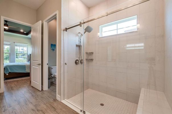 Bathroom, Bedroom, Glass Shower, Interior, Recessed Lighting, Wood Texture Flooring
