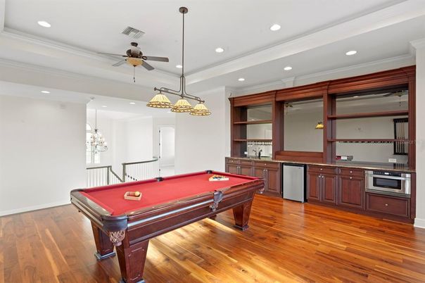 Billiard Table, Chandelier, Game Room, Interior, Pendant Lights, Recessed Lighting, Wood Texture Flooring