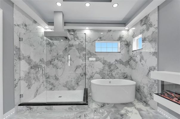 Bathroom, Free Standing Baths, Glass Shower, Interior, Marble, Marble Walls, Recessed Lighting