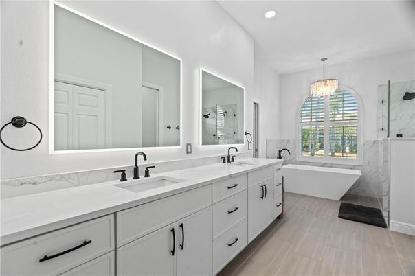 Bathroom, Chandelier, Dual Sink Vanities, Free Standing Baths, Interior, Marble, Marble Walls, Recessed Lighting