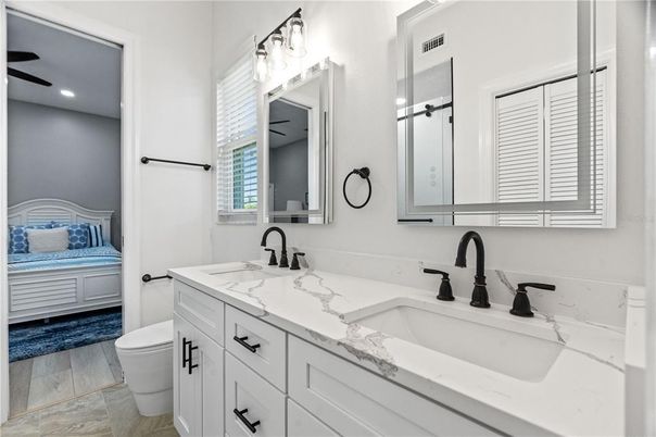 Bathroom, Dual Sink Vanities, Interior, Recessed Lighting, Wood Texture Flooring