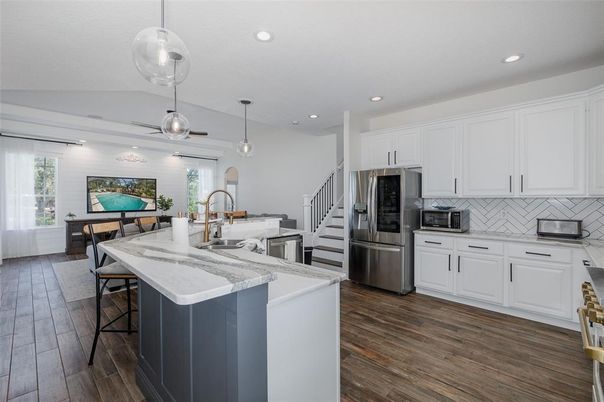 Dining room, Interior, Kitchen, Pendant Lights, Recessed Lighting, Stainless Steel Appliances, Wood Texture Flooring
