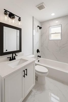 Bathroom, Dual Sink Vanities, Interior, Marble, Marble Walls, Recessed Lighting