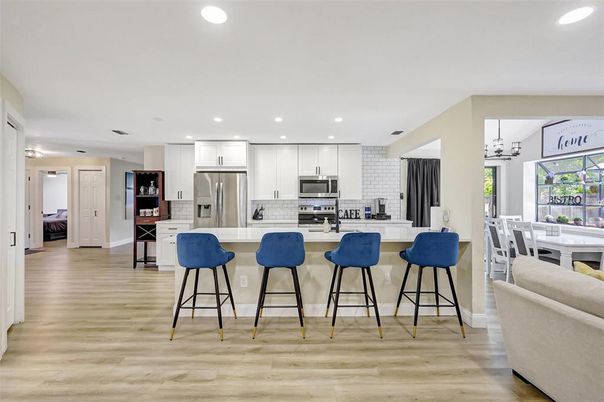 Dining room, Interior, Kitchen, Recessed Lighting, Stainless Steel Appliances, Wood Texture Flooring