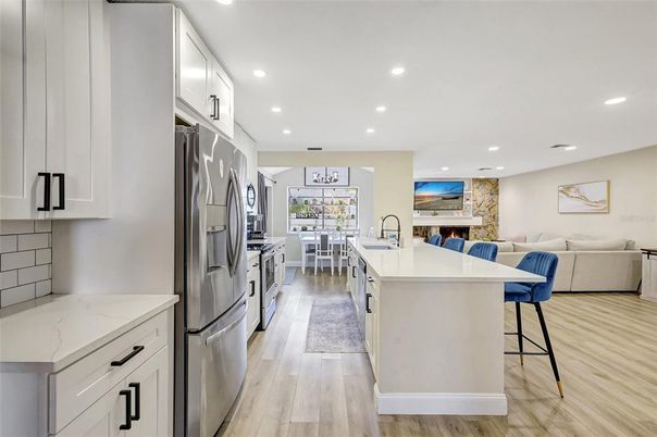Dining room, Interior, Kitchen, Living room, Recessed Lighting, Stainless Steel Appliances, Wood Texture Flooring