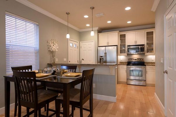 Dining room, Interior, Kitchen, Pendant Lights, Recessed Lighting, Stainless Steel Appliances, Wood Texture Flooring