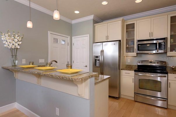 Interior, Kitchen, Pendant Lights, Recessed Lighting, Stainless Steel Appliances, Wood Texture Flooring