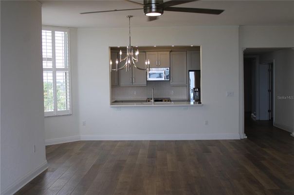 Chandelier, Interior, Kitchen, Pendant Lights, Recessed Lighting, Stainless Steel Appliances, Wood Texture Flooring