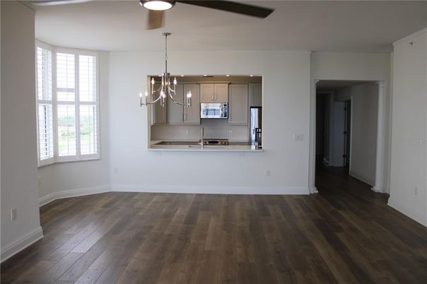 Chandelier, Empty room, Interior, Kitchen, Pendant Lights, Stainless Steel Appliances, Wood Texture Flooring