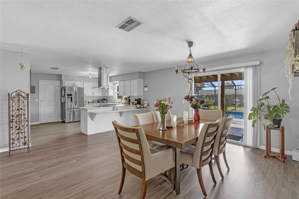 Dining room, Interior, Kitchen, Pendant Lights, Stainless Steel Appliances, Wood Texture Flooring
