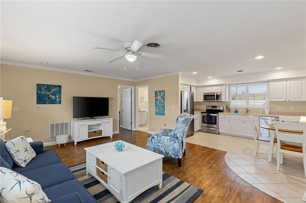 Dining room, Interior, Kitchen, Living room, Recessed Lighting, Stainless Steel Appliances, Wood Texture Flooring