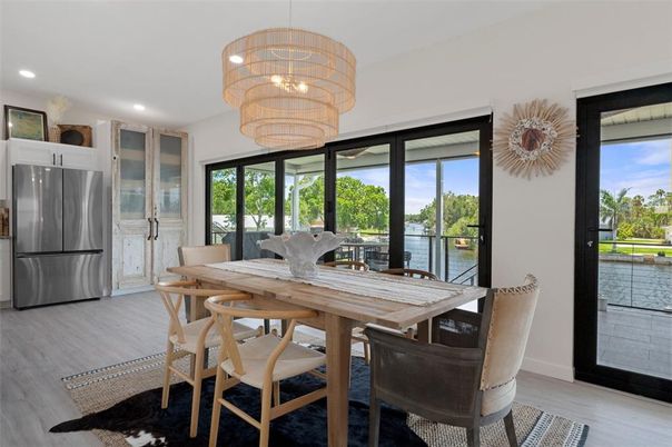 Chandelier, Dining room, Interior, Kitchen, Recessed Lighting, Stainless Steel Appliances, Wood Texture Flooring
