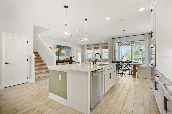 Dining room, Interior, Kitchen, Pendant Lights, Recessed Lighting, Stainless Steel Appliances, Wood Texture Flooring