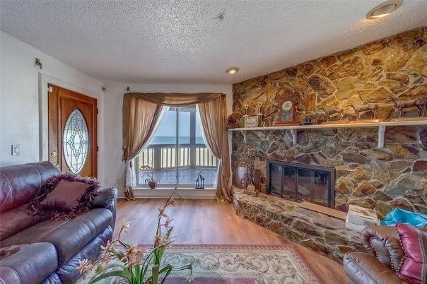 Fireplace, Interior, Living room, Recessed Lighting, Stone Walls, Wood Texture Flooring