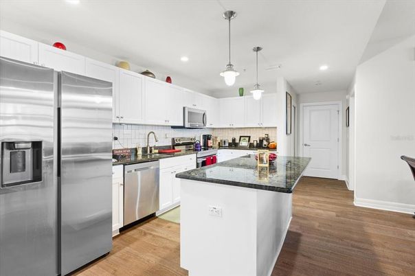 Interior, Kitchen, Pendant Lights, Recessed Lighting, Stainless Steel Appliances, Wood Texture Flooring