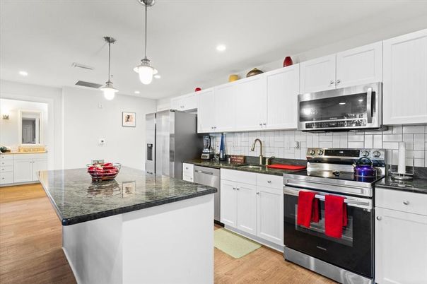 Interior, Kitchen, Pendant Lights, Recessed Lighting, Stainless Steel Appliances, Wood Texture Flooring