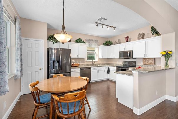 Dining room, Interior, Kitchen, Pendant Lights, Stainless Steel Appliances, Wood Texture Flooring