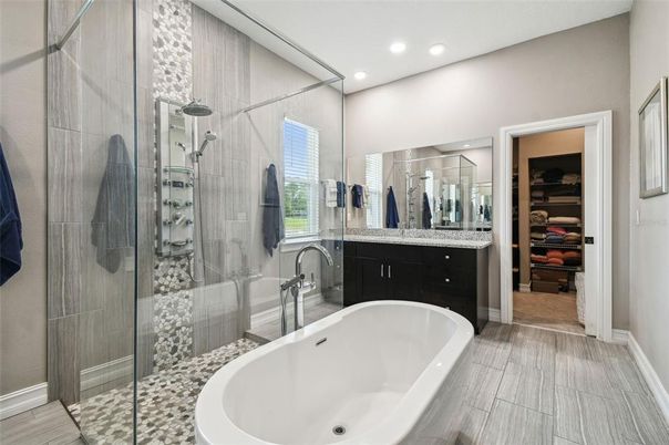 Bathroom, Dual Sink Vanities, Free Standing Baths, Glass Shower, Interior, Recessed Lighting, Walk-in Closets, Wood Texture Flooring