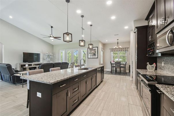 Chandelier, Dining room, Interior, Kitchen, Living room, Pendant Lights, Recessed Lighting, Wood Texture Flooring